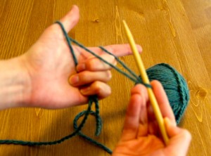 wrap yarn end around thumb