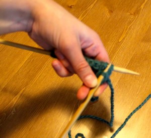 pull the needle and catch the wrapped yarn